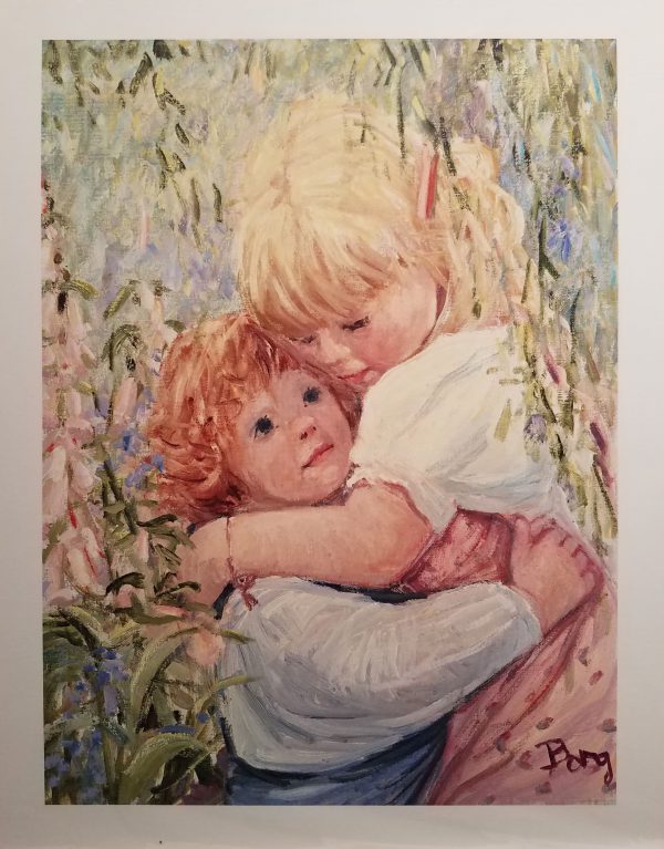 Little blond girl hugs little red haired boy under a tree.